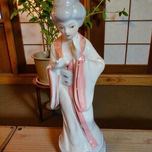 Charming Ceramic Figurine with Pink and White Details